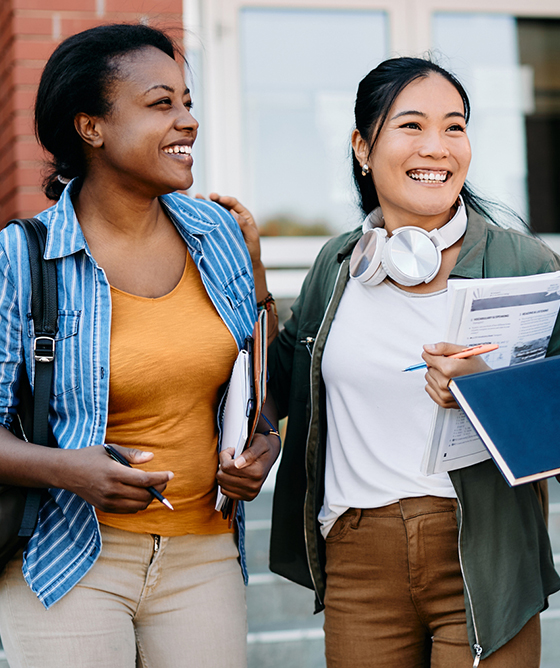 two young adults walking to class