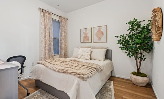 a furnished student apartment bedroom