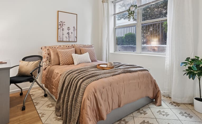 a furnished student apartment bedroom