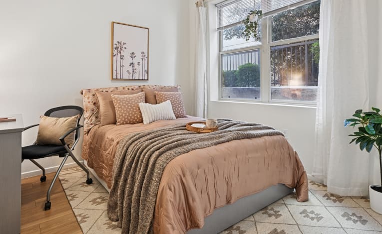 fully furnished bedroom with study desk